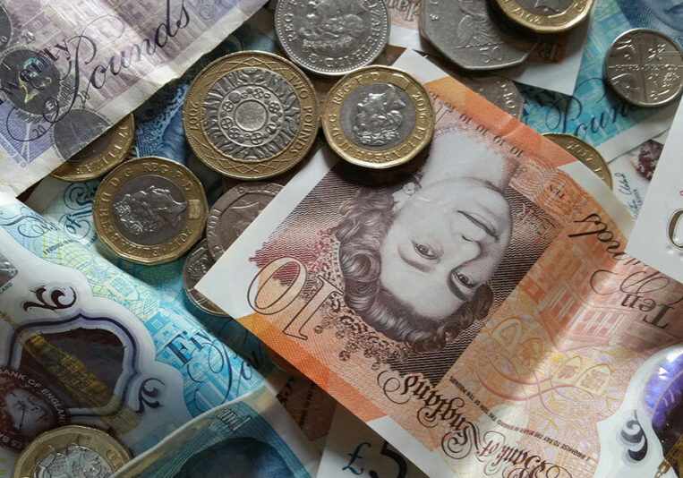 Picture of cash showing coins and notes